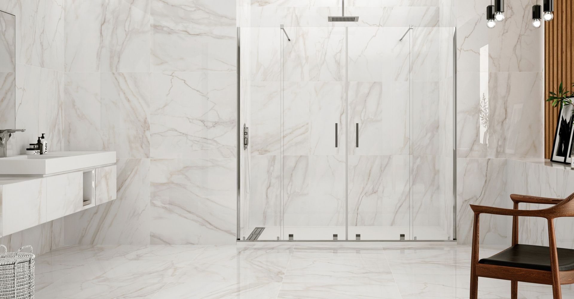 Baño con ducha con plato en blanco y grifería en acero inoxidable. Mampara con puertas correderas y perfilería en acero inoxidable. Encimera suspendida con lavabo.